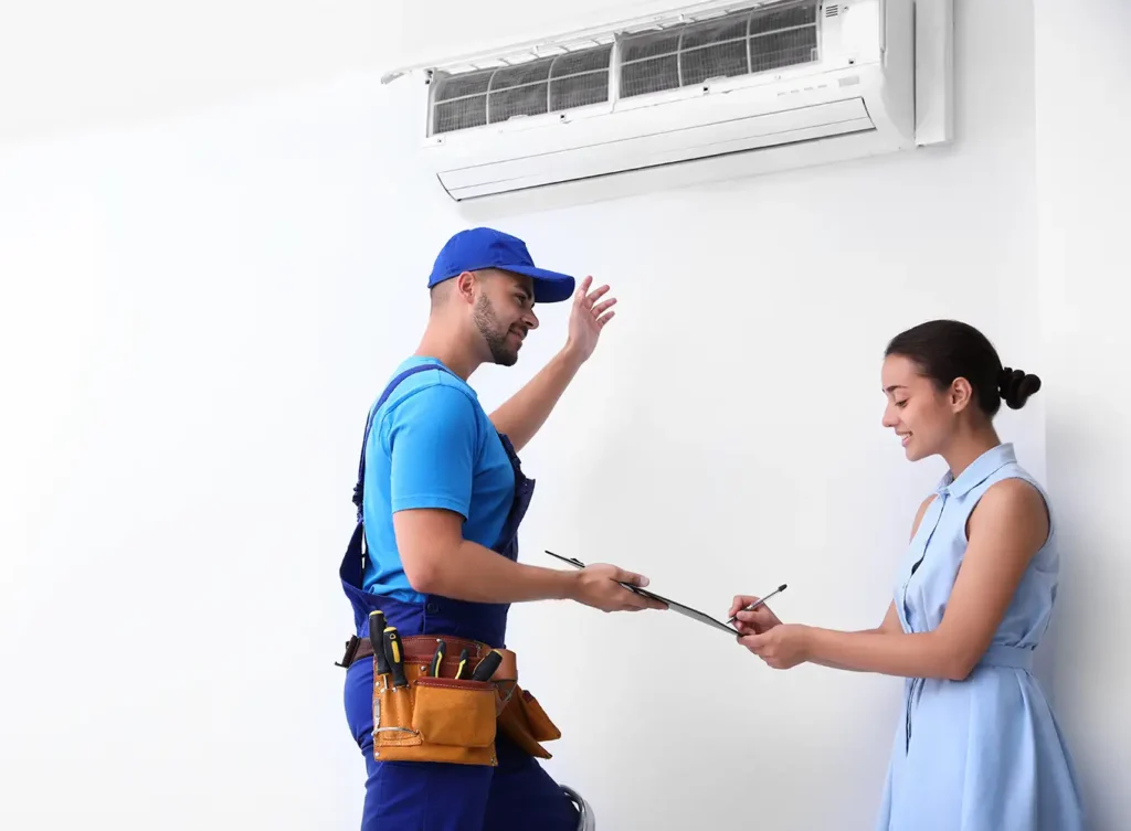 young woman talking to an heating and cooling expert